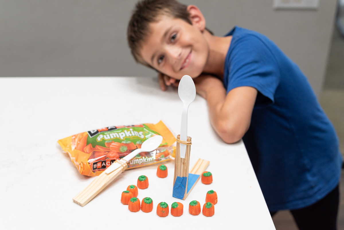 Candy Pumpkin Catapult - Easy Halloween STEM Activity for Kids!